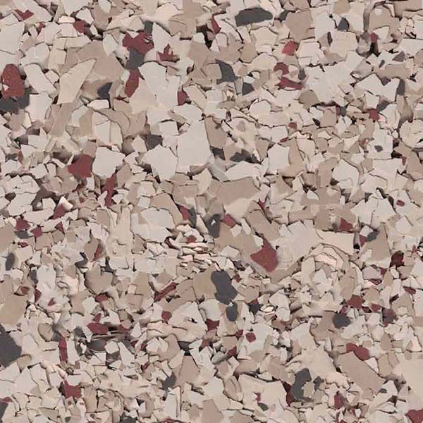 A close-up view of a textured surface featuring a blend of beige, cream, and reddish-brown small chips or flakes.