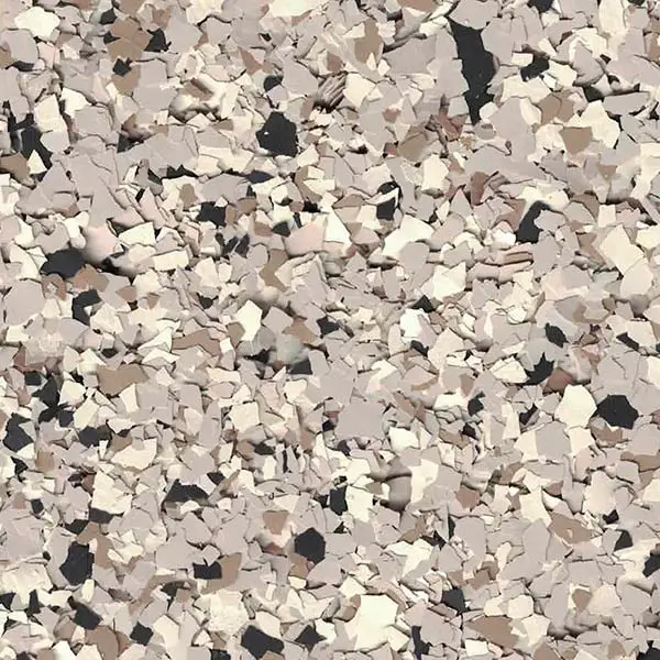 This image shows a textured surface with scattered, multicolored flakes in shades of beige, brown, and black, resembling decorative flooring material.