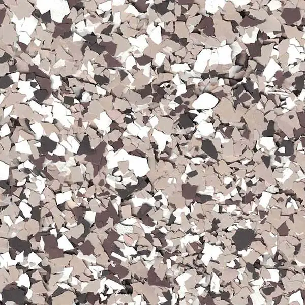 This image shows a close-up view of a textured surface with scattered, irregularly shaped pieces in shades of brown, black, and white.